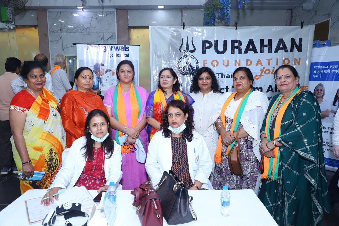 Healthcare professionals and community members at a Purahan Foundation health camp